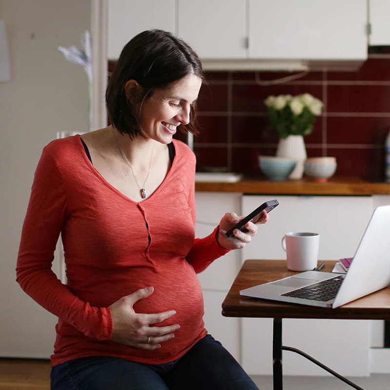 pregnant woman using phone