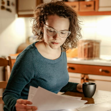 woman looking at paperwork