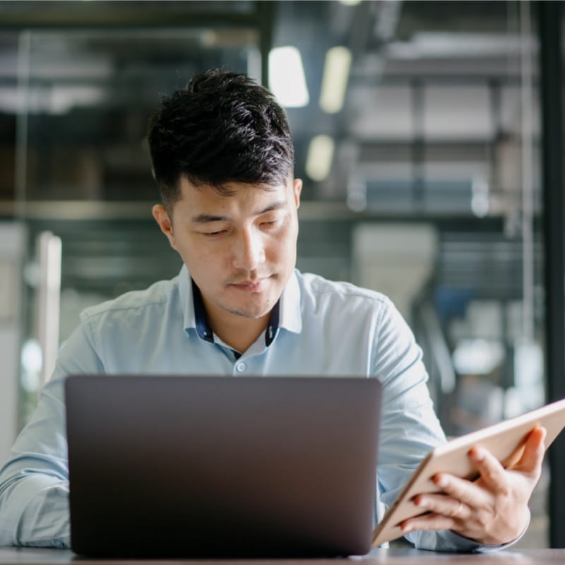 man looking at tablet