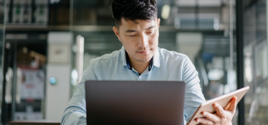 man looking at tablet