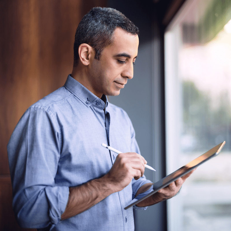 Man looking at tablet