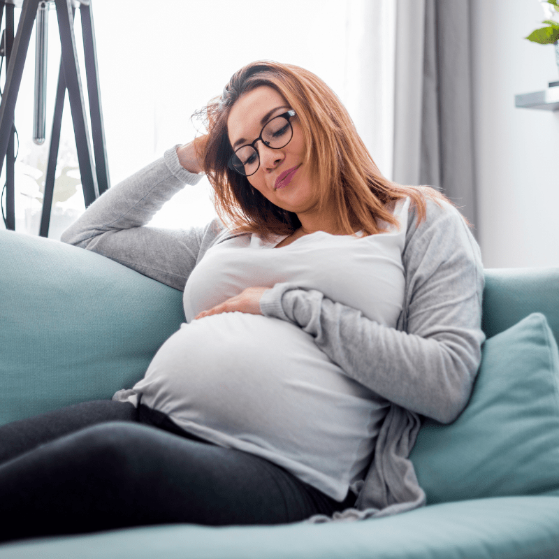 Pregnant woman on couch