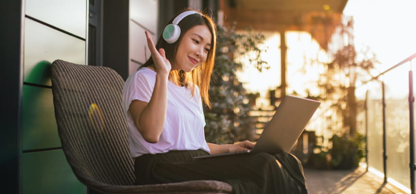 woman on headphones using computer
