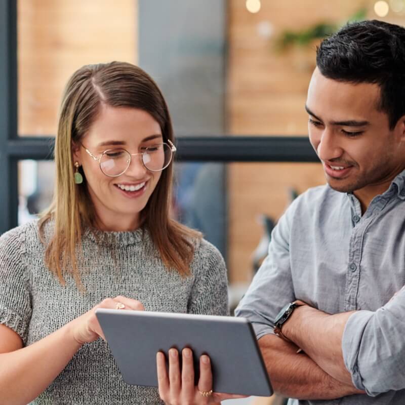 Man and woman looking at tablet