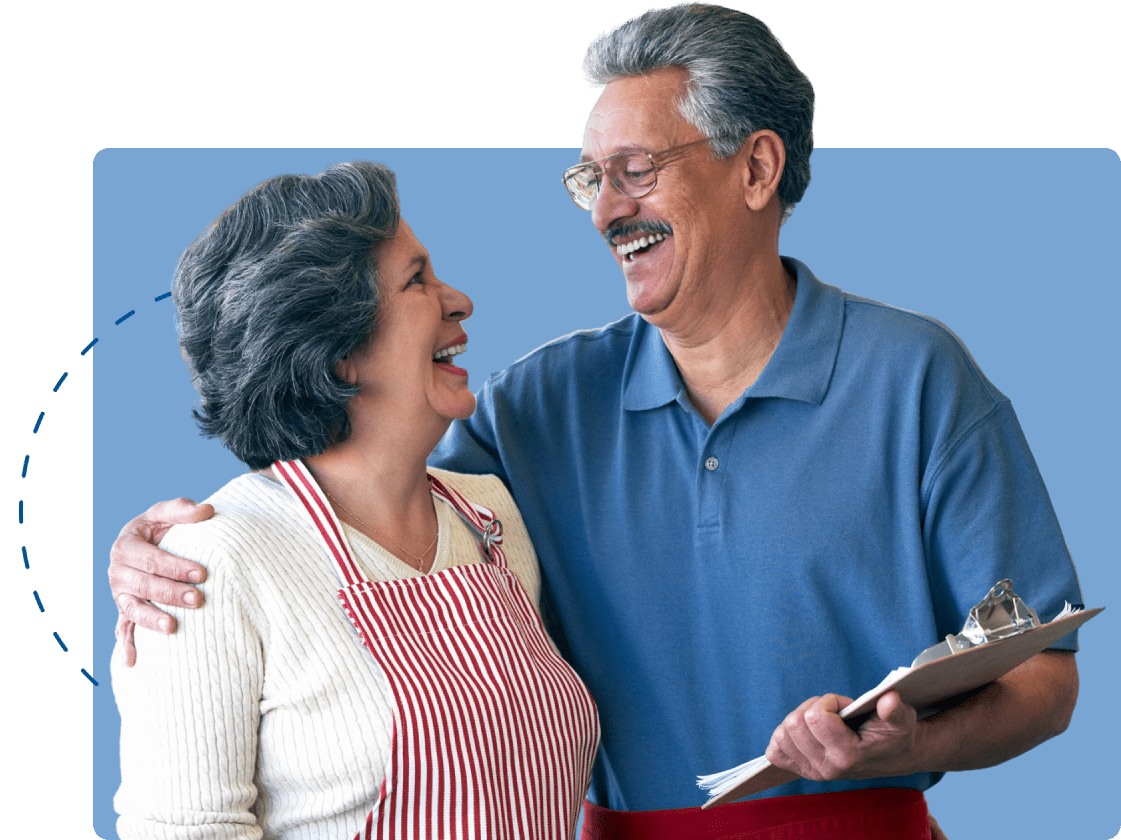 Man and woman embracing in half-hug as they see the results on the clipboard.