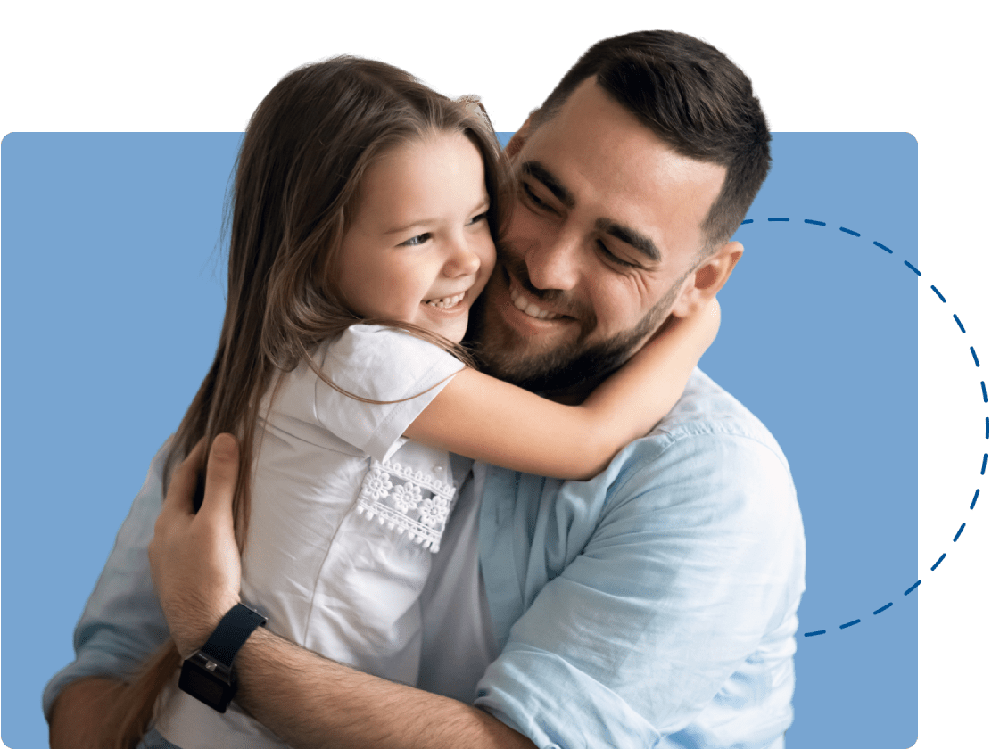 Girl hugging her father.