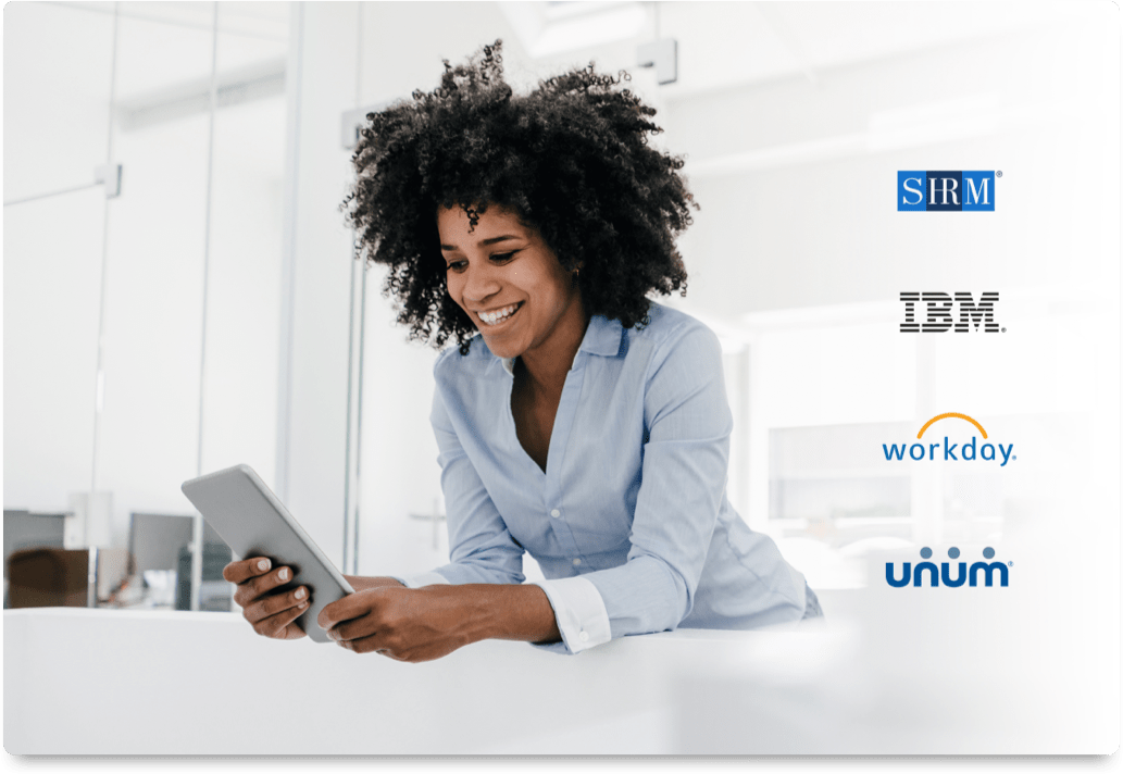 woman leaning on counter looking at tablet