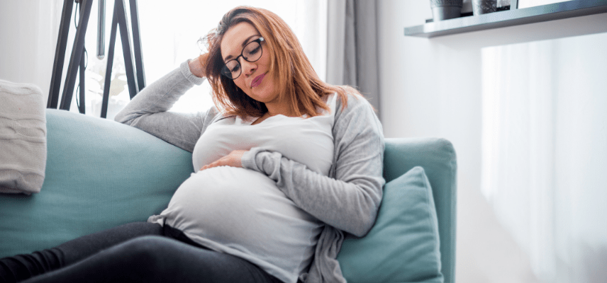 Pregnant woman on couch