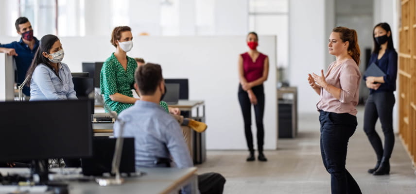 coworkers gathered in office
