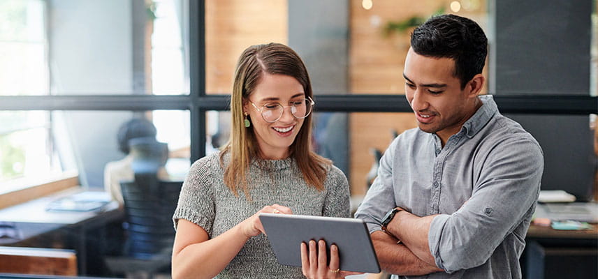 Man and woman looking at tablet