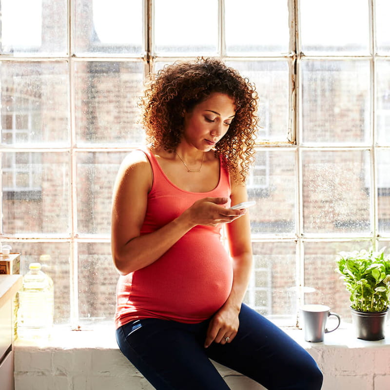pregnant woman on phone